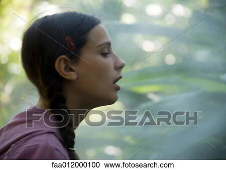 Girl in mist, side view View Large Photo Image Stock Image - Girl in mist, side view. Fotosearch