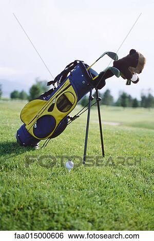 Golf bag propped up on golf course View Large Photo Image Stock Photograph - Golf bag propped up on golf course. Fotosearch