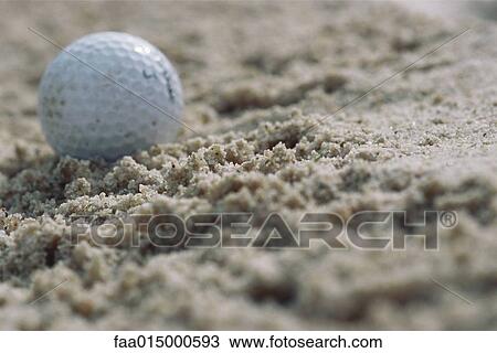 Golf ball in sand, close-up View Large Photo Image Stock Image - Golf ball in sand, close-up. Fotosearch