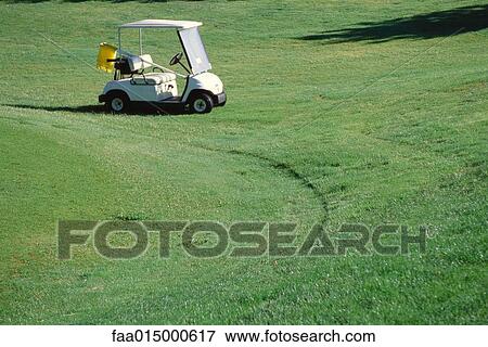 Golf cart parked on golf course View Large Photo Image Stock Photo - Golf cart parked on golf course. Fotosearch