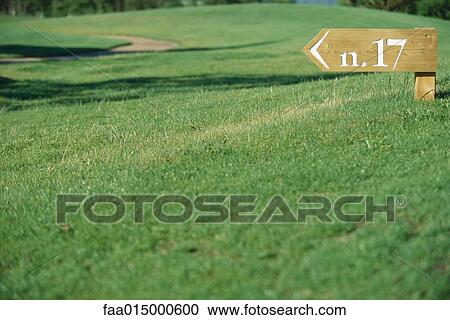 Golf course, sign to number seventeen hole View Large Photo Image Stock Image - Golf course, sign to number seventeen hole. Fotosearch