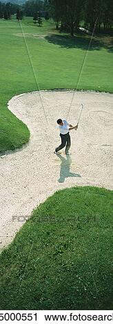 Golfer in sand pit, high angle view View Large Photo Image Stock Image - Golfer in sand pit, high angle view. Fotosearch