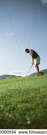 Golfer, low angle view View Large Photo Image Picture - Golfer, low angle view. Fotosearch