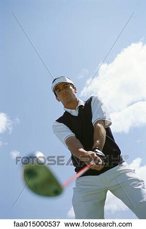 Golfer, low angle view View Large Photo Image Stock Photo - Golfer, low angle view. Fotosearch