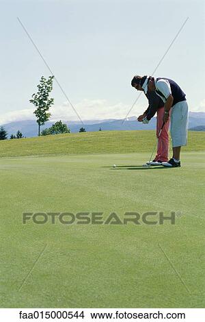 Golfer taking lessons View Large Photo Image Picture - Golfer taking lessons. Fotosearch