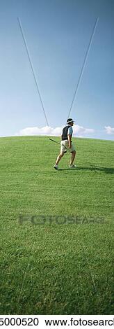 Golfer walking View Large Photo Image Stock Image - Golfer walking. Fotosearch