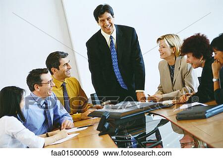 Group of business associates having conference call View Large Photo Image Stock Photo - Group of business associates having conference call. Fotosearch