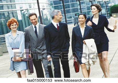 Group of business executives walking in business park View Large Photo Image Stock Image - Group of business executives walking in business park. Fotosearch
