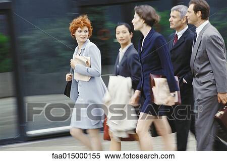 Group of business executives walking, blurred motion View Large Photo Image Stock Photography - Group of business executives walking, blurred motion. Fotosearch