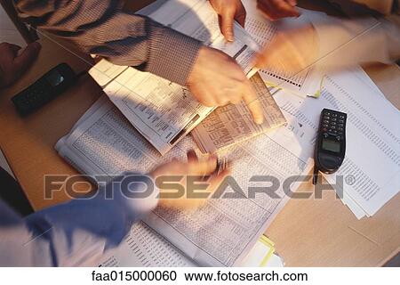 Hands pointing to financial pages of newspapers, blurred motion View Large Photo Image Stock Image - Hands pointing to financial pages of newspapers, blurred motion. Fotosearch