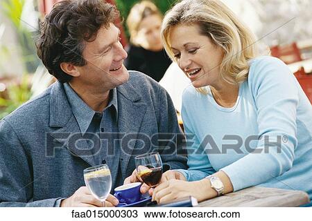 Mature couple, sitting at outdoor cafe View Large Photo Image Stock Image - Mature couple, sitting at outdoor cafe. Fotosearch