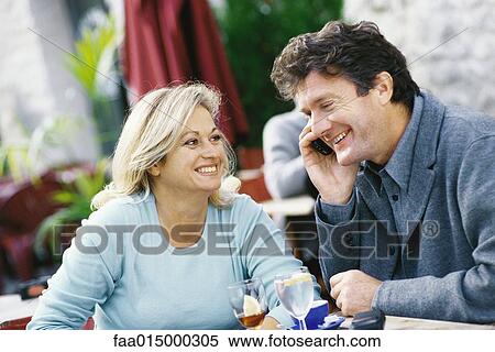 Mature couple, sitting at outdoor cafe View Large Photo Image Stock Photography - Mature couple, sitting at outdoor cafe. Fotosearch
