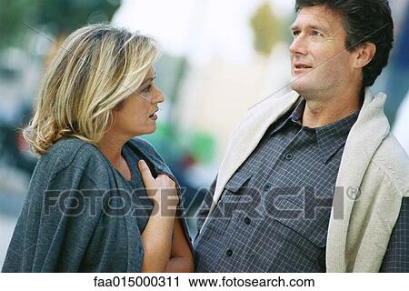 Mature couple talking View Large Photo Image Stock Image - Mature couple talking. Fotosearch