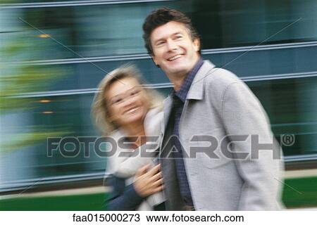Middle aged couple walking, blurred motion View Large Photo Image Stock Image - Middle aged couple walking, blurred motion. Fotosearch