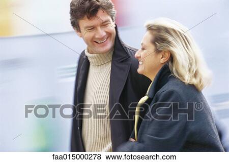 Middle aged couple walking, blurred motion View Large Photo Image Stock Photo - Middle aged couple walking, blurred motion. Fotosearch