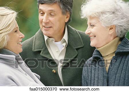 Senior adults, talking View Large Photo Image Stock Image - Senior adults, talking. Fotosearch