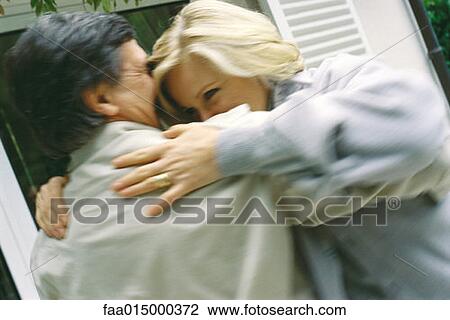 Senior couple embracing, blurred motion View Large Photo Image Stock Image - Senior couple embracing, blurred motion. Fotosearch
