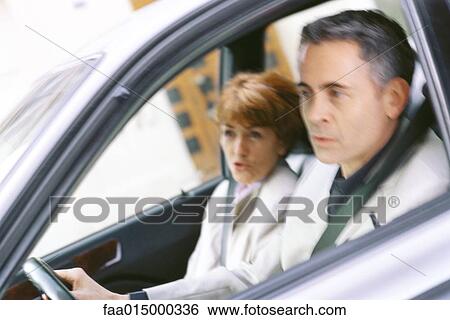 Senior couple in car, looking out of frame View Large Photo Image Stock Photograph - Senior couple in car, looking out of frame. Fotosearch