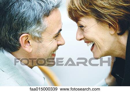 Senior couple, laughing, face to face, close-up View Large Photo Image Stock Photo - Senior couple, laughing, face to face, close-up. Fotosearch