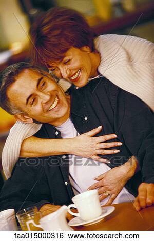 Senior couple, woman embracing man from behind View Large Photo Image Stock Photograph - Senior couple, woman embracing man from behind. Fotosearch