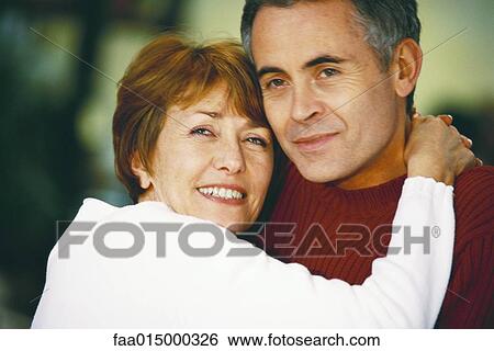 Stock Photograph - Senior couple, woman's head on man's shoulder, portrait. Fotosearch