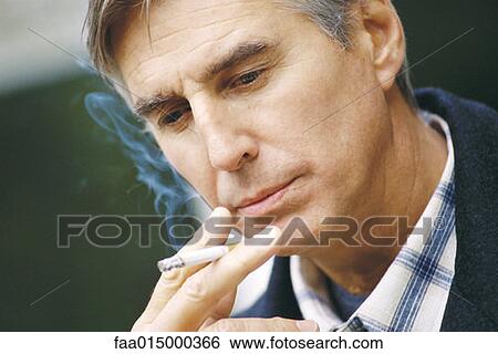 Senior man smoking View Large Photo Image Stock Photograph - Senior man smoking. Fotosearch