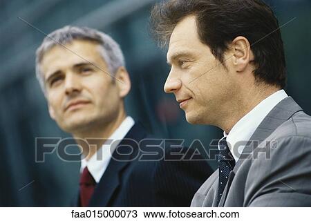 Two businessmen, head and shoulders, portrait View Large Photo Image Stock Image - Two businessmen, head and shoulders, portrait. Fotosearch