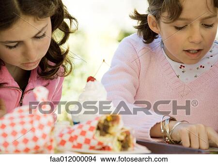 Two girls with fast food View Large Photo Image Picture - Two girls with fast food. Fotosearch