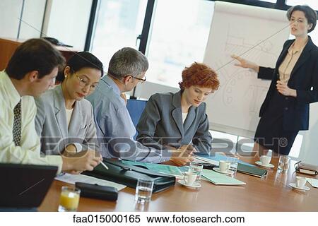 Woman giving business presentation View Large Photo Image Stock Photography - Woman giving business presentation. Fotosearch