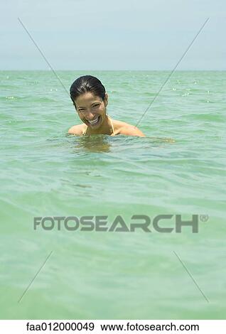 Woman in sea, laughing View Large Photo Image Stock Photo - Woman in sea, laughing. Fotosearch