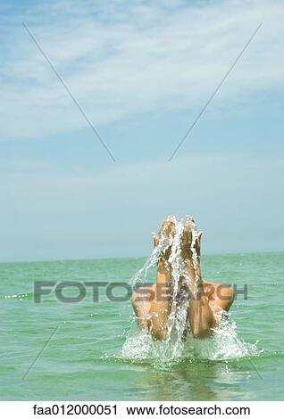 Woman splashing water with hands, in sea View Large Photo Image Stock Image - Woman splashing water with hands, in sea. Fotosearch