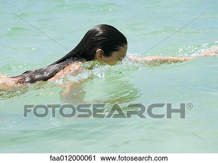 Woman swimming View Large Photo Image Stock Image - Woman swimming. Fotosearch
