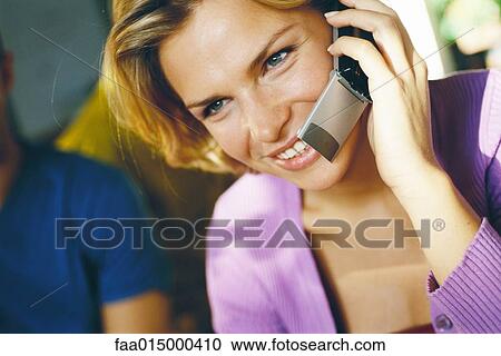 Woman using cell phone, close-up View Large Photo Image Stock Image - Woman using cell phone, close-up. Fotosearch