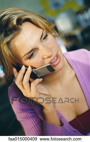 Stock Photo - Woman using cell phone, portrait. Fotosearch