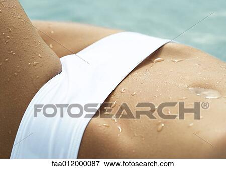 Woman wearing bikini, extreme close-up of abdomen View Large Photo Image Stock Photo - Woman wearing bikini, extreme close-up of abdomen. Fotosearch