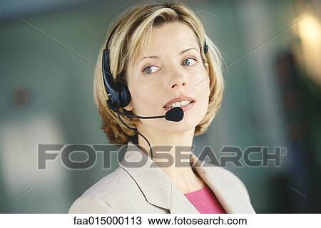 Woman wearing headset View Large Photo Image Stock Image - Woman wearing headset. Fotosearch