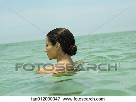 Woman with bare shoulders in sea, rear view View Large Photo Image Stock Photo - Woman with bare shoulders in sea, rear view. Fotosearch