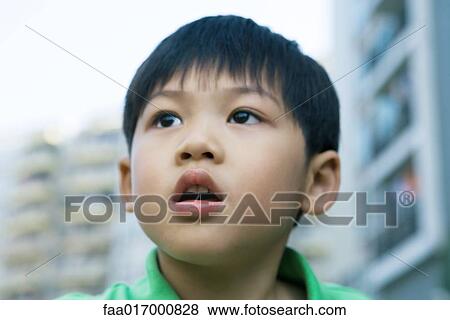 Stock Photo - Boy, head and shoulders, portrait. Fotosearch