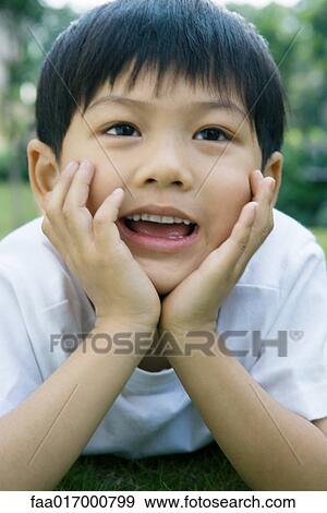 Boy smiling, head and shoulders, portrait View Large Photo Image Stock Photo - Boy smiling, head and shoulders, portrait. Fotosearch