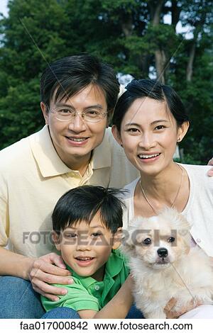 Boy with parents and pet dog, portrait View Large Photo Image Stock Image - Boy with parents and pet dog, portrait. Fotosearch