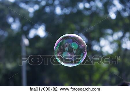 Bubble floating in air View Large Photo Image Stock Image - Bubble floating in air. Fotosearch