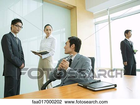 Business executives working in office View Large Photo Image Stock Image - Business executives working in office. Fotosearch