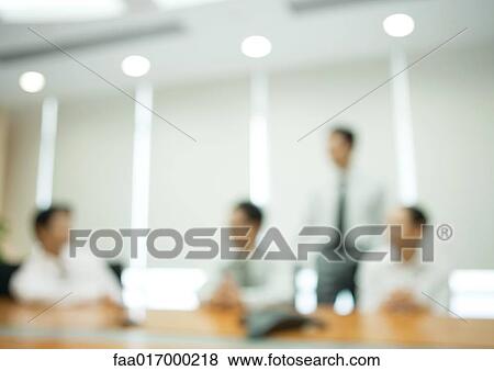 Stock Photo - Business meeting, blurred silhouettes. Fotosearch