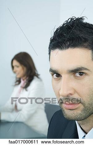 Businessman, glaring at camera View Large Photo Image Stock Image - Businessman, glaring at camera. Fotosearch