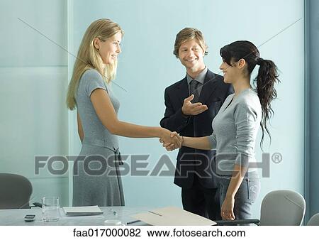Businessman introducing teenage girl to young professional woman View Large Photo Image Stock Image - Businessman introducing teenage girl to young professional woman. Fotosearch