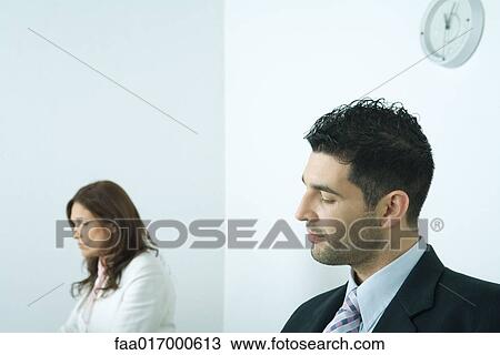 Stock Image - Businessman looking down. Fotosearch