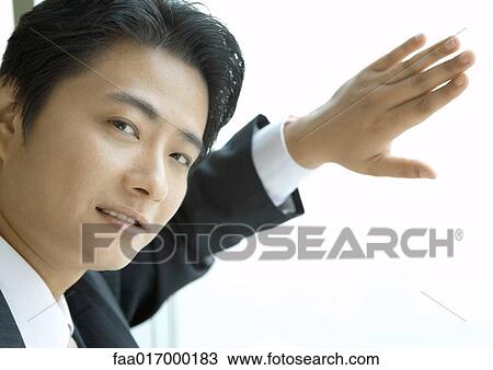 Businessman standing with arms folded, smiling View Large Photo Image Stock Image - Businessman standing with arms folded, smiling. Fotosearch