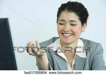 Businesswoman holding yinyang balls, laughing View Large Photo Image Picture - Businesswoman holding yinyang balls, laughing. Fotosearch