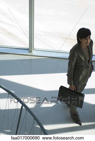 Businesswoman in silhouette, high angle view View Large Photo Image Stock Image - Businesswoman in silhouette, high angle view. Fotosearch