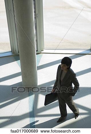 Businesswoman in silhouette, high angle view View Large Photo Image Stock Photo - Businesswoman in silhouette, high angle view. Fotosearch